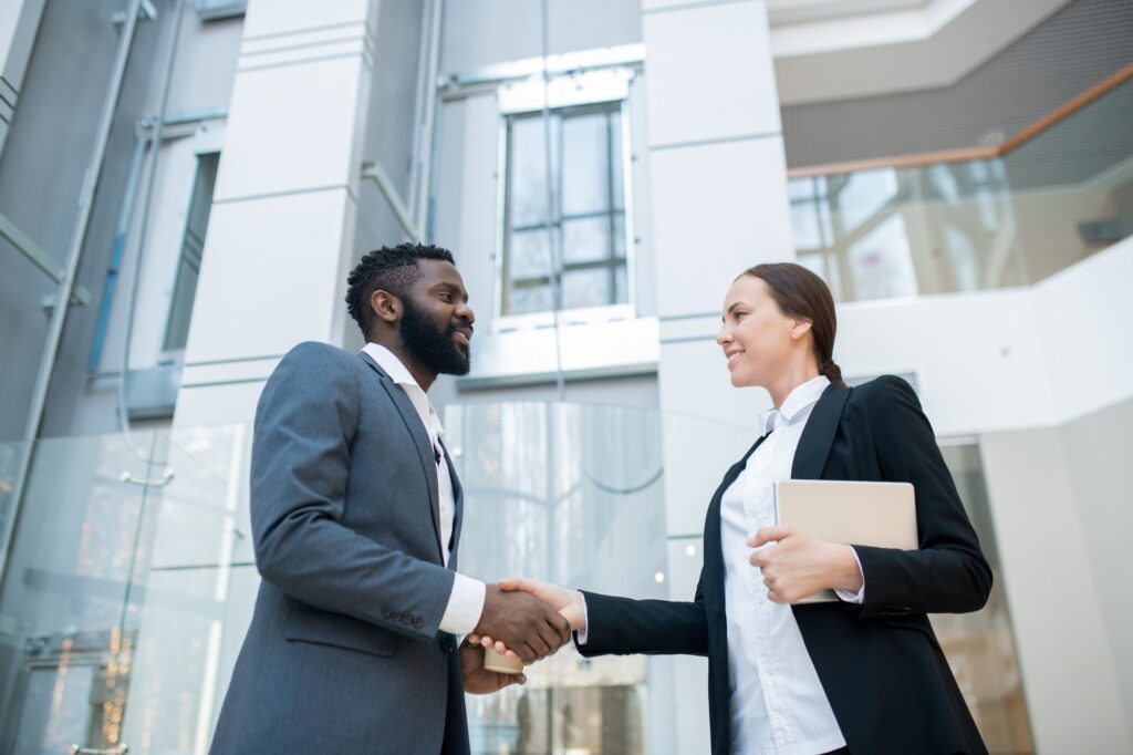 Greeting business colleague in company