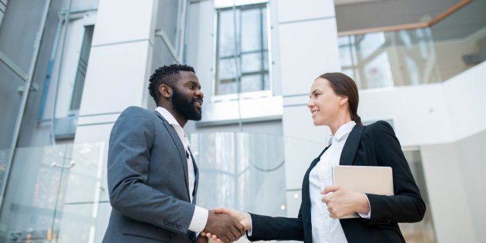 Greeting business colleague in company